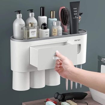 Toothpaste dispenser with toothbrush holder